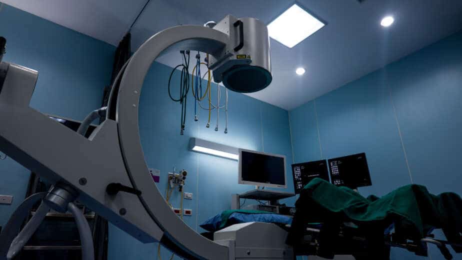 Advanced surgical imaging equipment in a modern operating room used for minimally invasive procedures, ensuring precision and patient safety in healthcare facilities.