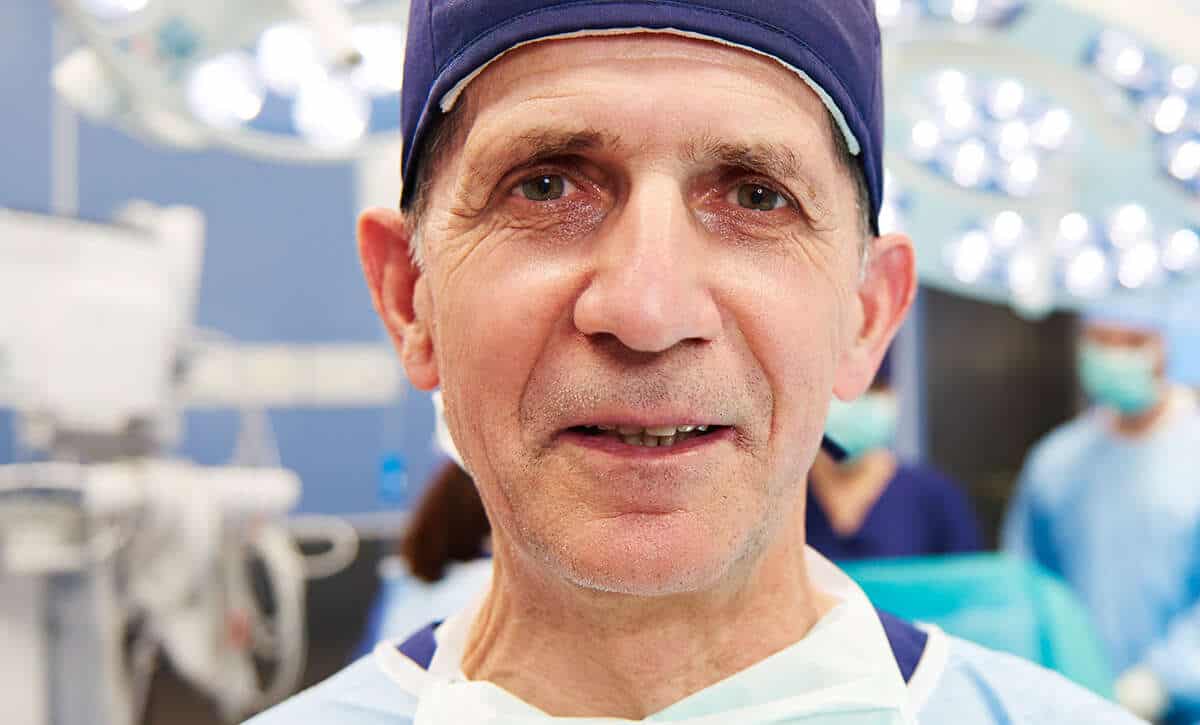 Endoscopic surgeon in operating room, emphasizing advanced minimally invasive surgical techniques.